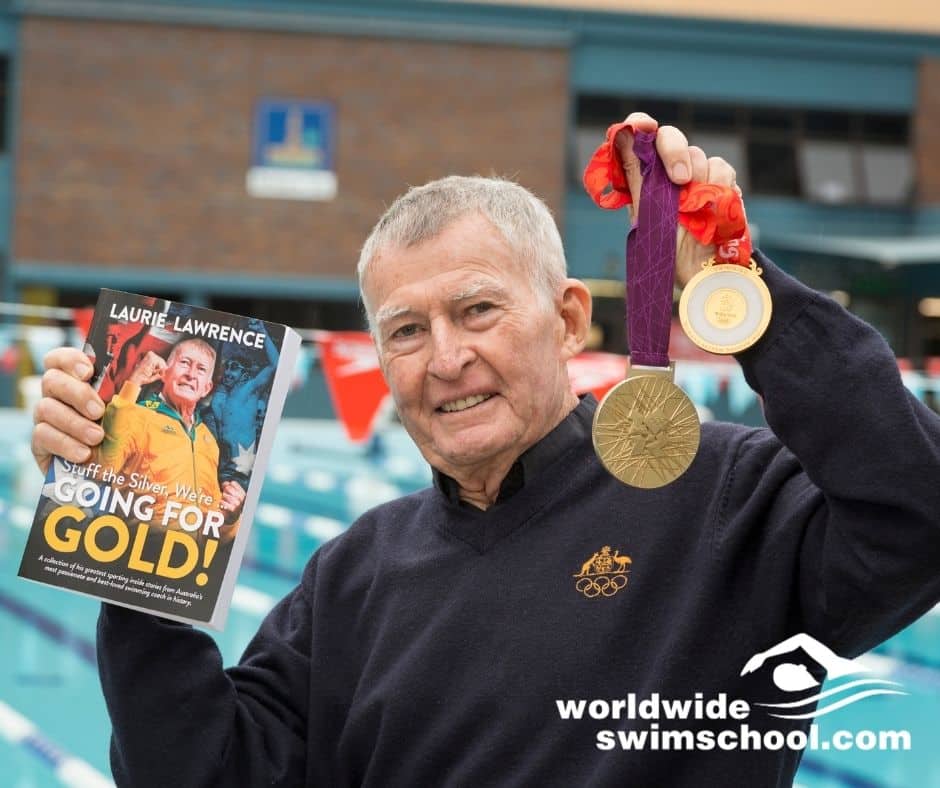 Laurie lawrence holding stuff the sliver were going for gold book with medal