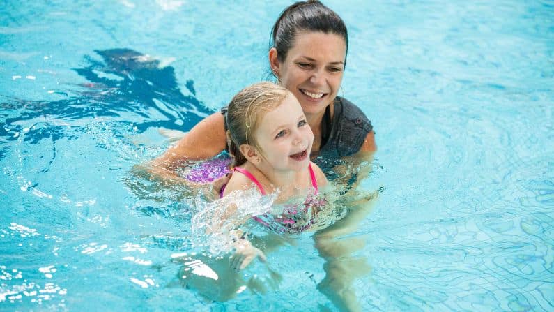 parent and child in the water creating positive experiences