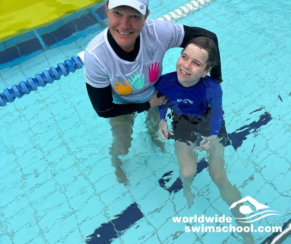 Swim teacher and student in the water